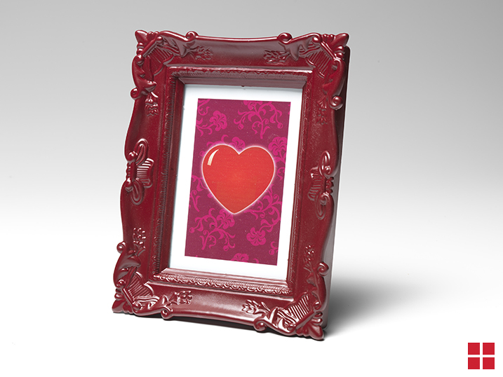 Hear artwork framed with a wooded red frame