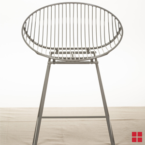 An unpainted gray metal stool.