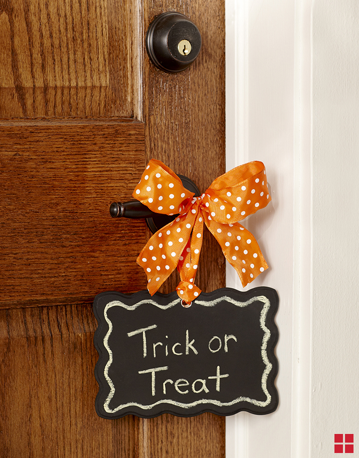 Halloween door hanger on wood door